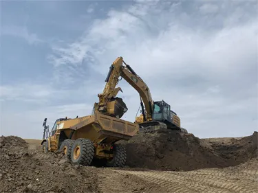 Excavator loading a Rock Truck