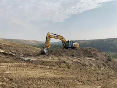 Excavator digging dirt