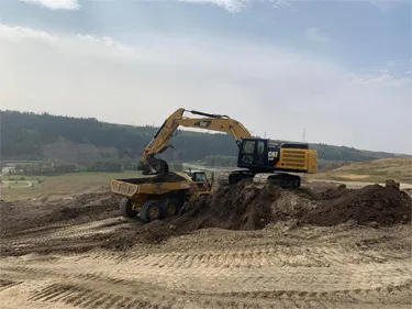 Excavator loading a Rock Truck